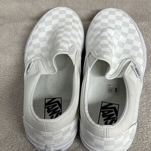 Vans women’s Checkered White Slip-On Sneakers, brand new never been worn.